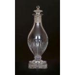 AN EARLY 19th CENTURY GLASS VINEGAR BOTTLE, of baluster shape, with flattened urn stopper,