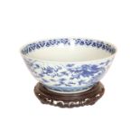 A LARGE CHINESE BLUE AND WHITE BOWL, painted with dragons, bears six character mark,