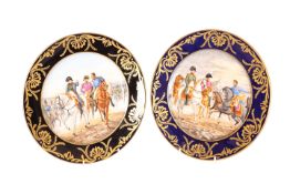 A NEAR PAIR OF CONTINENTAL PAINTED AND GILDED PORCELAIN PLATES, each signed GARNIER,