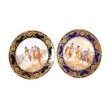 A NEAR PAIR OF CONTINENTAL PAINTED AND GILDED PORCELAIN PLATES, each signed GARNIER,