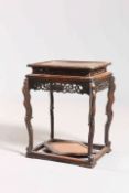 A CHINESE CARVED STAND, LATE 19TH CENTURY, with fretwork carving and lozenge shaped shelf stretcher.