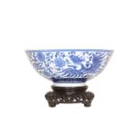 A CHINESE BLUE AND WHITE PORCELAIN BOWL, painted to the exterior and the well with a phoenix,