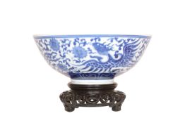 A CHINESE BLUE AND WHITE PORCELAIN BOWL, painted to the exterior and the well with a phoenix,