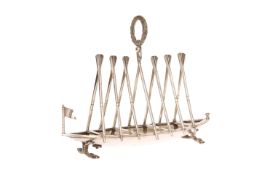 AN UNUSUAL 19th CENTURY SILVER-PLATED BOAT-FORM TOAST RACK,