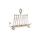 AN UNUSUAL 19th CENTURY SILVER-PLATED BOAT-FORM TOAST RACK,