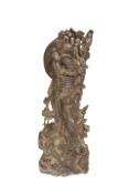 A LARGE CHINESE BRONZE FIGURE OF A SAGE OR DEITY, a dragon at his feet, a tiger above his head,