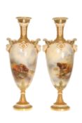 A PAIR OF ROYAL WORCESTER VASES PAINTED WITH HIGHLAND CATTLE, each signed by John Stinton, shape no.