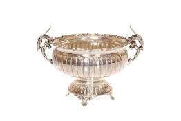 A GREEK SILVER BOWL, with reeded body and scrolling handles with acanthus leaves, stamped 925. 17.