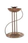 A CONTINENTAL WROUGHT-METAL CANDLESTICK IN THE ART NOUVEAU TASTE,