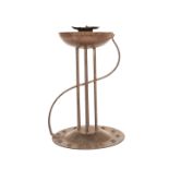 A CONTINENTAL WROUGHT-METAL CANDLESTICK IN THE ART NOUVEAU TASTE,