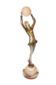 AN ART DECO STYLE PATINATED BRONZE AND FAUX IVORY FIGURE OF A DANCER,