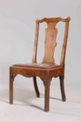 A COUNTRY CHIPPENDALE OAK CHAIR, PROBABLY WELSH, with square section legs and shaped solid splat.