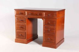 A VICTORIAN MAHOGANY DESK OF SMALL PROPORTIONS, the leather inset top with moulded edge,