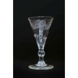 A LATE 18th CENTURY WINE GLASS, the trumpet bowl part panelled,