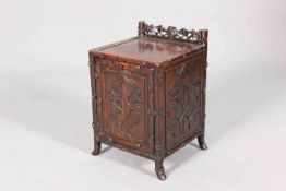A CHINESE CARVED HARDWOOD COAL BOX, CIRCA 1900, with fall-front, carved with fruiting vine.