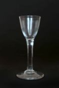 A CORDIAL GLASS, LATE 18th CENTURY, on a long tapering stem with circular foot.