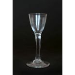 A CORDIAL GLASS, LATE 18th CENTURY, on a long tapering stem with circular foot.