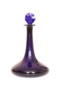 A COBALT BLUE GLASS SHIP'S DECANTER OF BRISTOL TYPE, c. 1800, with faceted disc stopper.