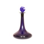 A COBALT BLUE GLASS SHIP'S DECANTER OF BRISTOL TYPE, c. 1800, with faceted disc stopper.