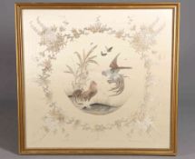 A LARGE JAPANESE SILK NEEDLEWORK PICTURE, depicting cockerels, butterflies and foliage, framed.