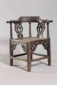 A CARVED OAK CORNER CHAIR, 18TH/19TH CENTURY, with pierced splats,