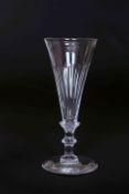 AN EARLY 19th CENTURY WINE GLASS, with elongated trumpet bowl, part-fluted,