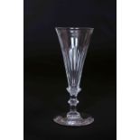 AN EARLY 19th CENTURY WINE GLASS, with elongated trumpet bowl, part-fluted,