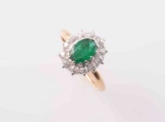 AN EMERALD AND DIAMOND RING,