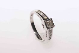 18 carat white gold diamond ring with central nine stone square set cluster flanked with four