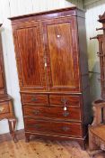 Edwardian inlaid mahogany press having two panelled doors above two short and two long drawers