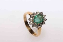 9 carat gold oval emerald and round brilliant diamond cluster ring