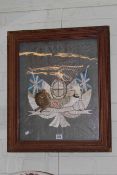Embroidered Trapunto of The Royal Coat of Arms, in leaf moulded frame,