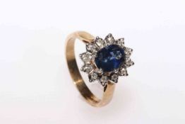 9 carat yellow gold oval sapphire and round brilliant cut diamond cluster ring