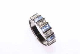 Topaz and diamond ring comprising of three pairs of topaz parted with four pairs of princess cut