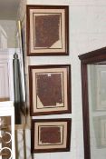 Three framed leather Mexican images