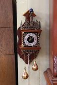 Continental wood and brass double weight wall clock