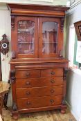Victorian mahogany cabinet bookcase having two glazed panelled doors above a base of six drawers on