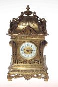Ornate brass striking bracket clock with enamel dial