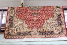 Keshan carpet with a red ground 2.30 by 1.