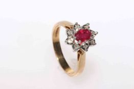 Ruby and round brilliant cut diamond cluster ring in 9 carat gold
