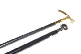 Ebonised walking cane with incorporated compass handle and ebonised walking stick with brass handle