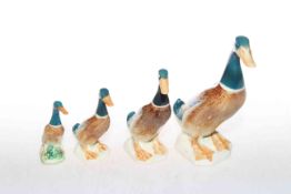 Set of four Beswick graduated standing ducks