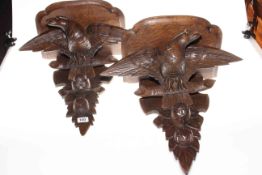 Pair of carved oak eagle design wall bracket shelves