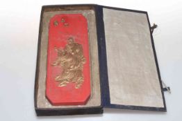 Chinese boxed red ware tablet moulded with gilt figure and script