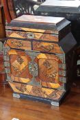 Oriental inlaid and lacquered table top cabinet having a series of compartments and drawers