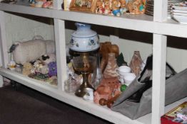 Collection of pottery sheep ornaments, oil lamp, heifer hide,