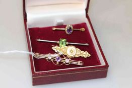 Four antique brooches including peridot and seed pearls, amethyst,