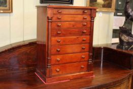 Miniature stained pine Wellington chest of eight graduated drawers,