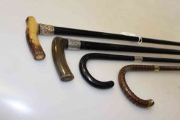 Collection of four gentleman's canes/walking sticks