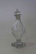 Early 19th Century glass vinegar bottle with 'lemon squeezer' foot,
